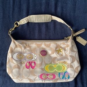 Coach purse Tan with design perfect for summer